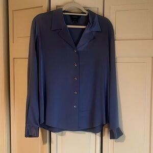 Blue long-sleeve satin button-down blouse collar and button cuffs.